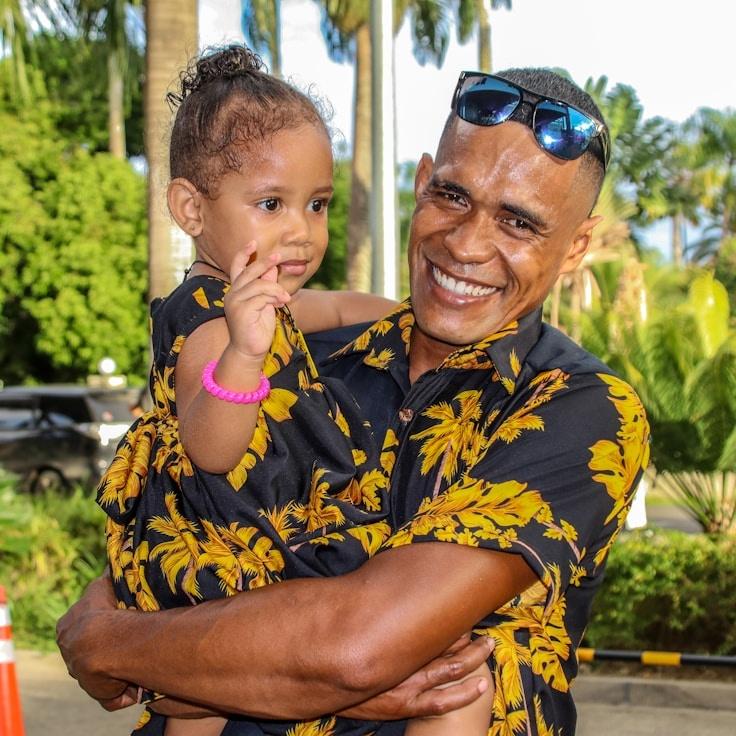 Avery Sloan, Lead Design Curator at FreshParkStudio, reviewing corporate floral arrangements